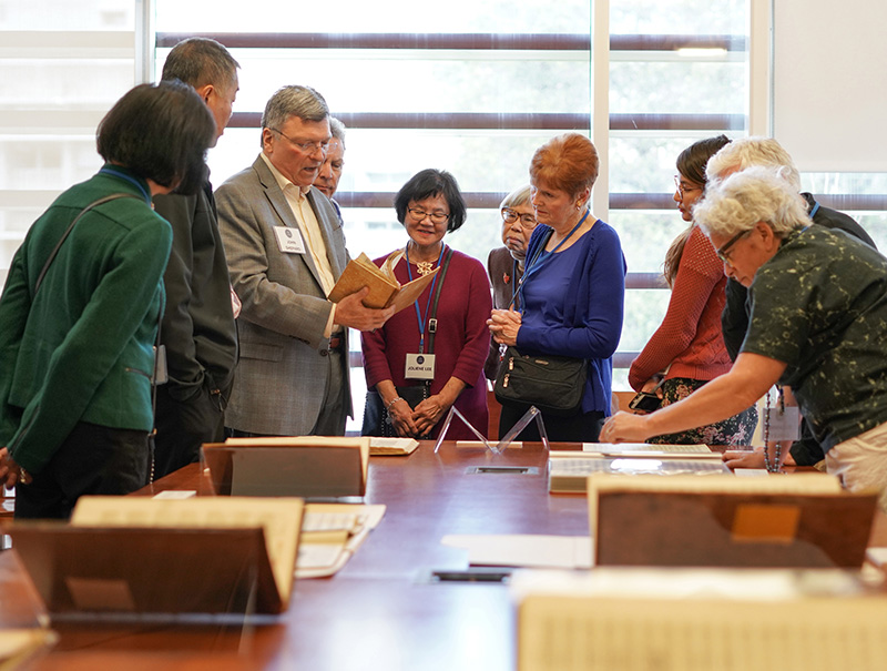 John Shepard, Curator of Music Collections, third from left, talks about a rare collection of books during a luncheon for the Library Legacy Circle at the Music Library on Feb. 10, 2018. (Photos by Cade Johnson for the UC Berkeley Library)